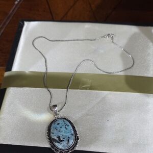 Artisan Silver Necklace with Blue Stone Pendant